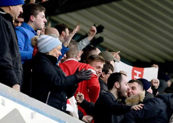 Sunderland fans celebrate Bryan Oviedo's goal at Millwall.