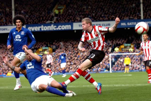 John Heitinga blocks an attempted shot by Sunderland's James McClean. Picture by Peter Berry