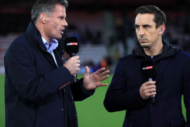 Carragher, left, with fellow Sky Sports pundit Gary Neville. Pic: PA.