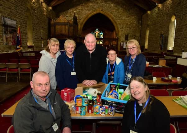 Stuart Hudson, front left, of Durham Christain partnership and Reverend Jane Grieve, front right, and volunteers at a new foodbank point at Holy Trinity Church, Wingate.