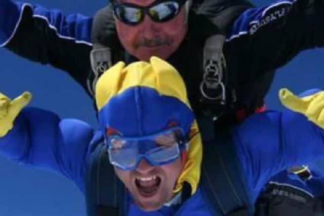 Taking part in his skydive.
