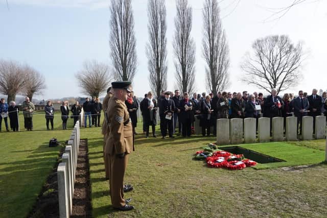 Riflemen from the 3rd Battalion, the Rifles, stand alongside dignitaries, officials, family members and members of the public during the burial service of Private Edmundson.