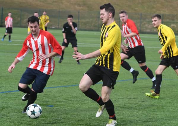 Lakeside SSC (red/white) take on Millfield Free Gardeners in the Sunderland Sunday League last week. Picture by Kevin Brady