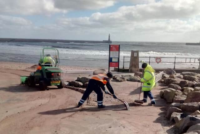 Council teams clean up the beach.