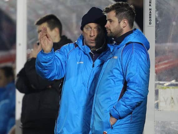 Ged McNamee offers advice to Hartlepool United caretaker Matthew Bates.