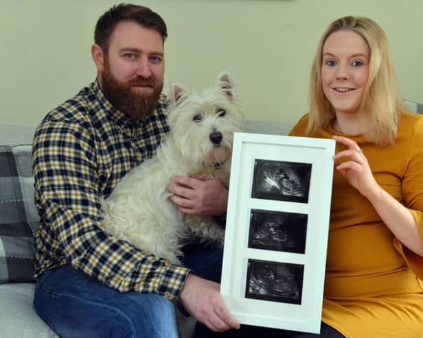 Ashleigh Powell and Steve Taylor lit up Sunderland Empire blue for their pregnancy gender with Terrier Archy