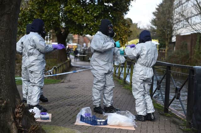 Police teams bag up swabs following the attack in Salisbury. Picture by Ben Birchall/PA Wire