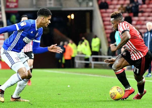 Kazenga Lua Lua (right) takes on Ipswich. Picture by Frank Reid