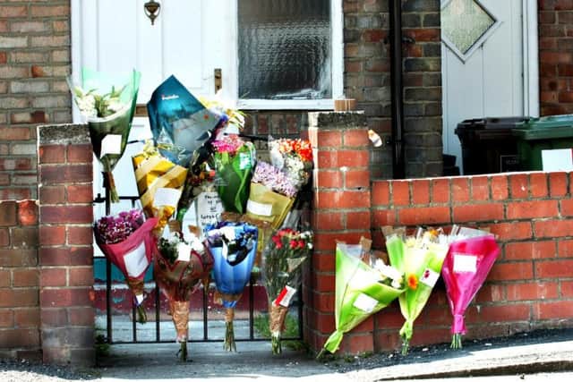 Floral tributes in the Pennywell street where Kevin Johnson was killed.