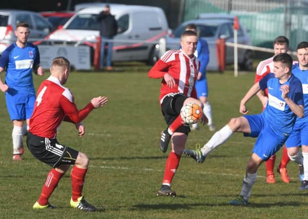 Sunderland RCA (red/white) take on Seaham Red Star (blue) on Saturday. Picture by Kevin Brady