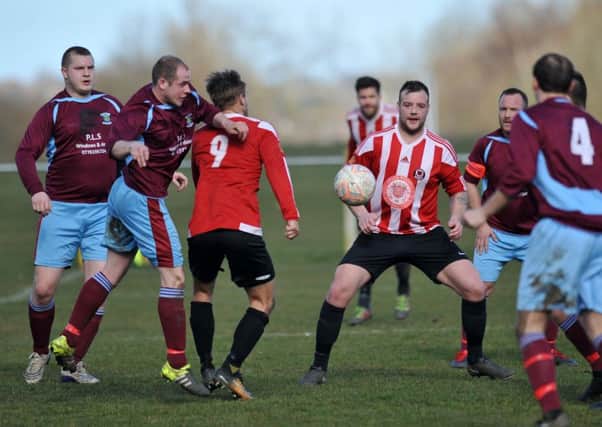 Sunderland West End (red/white) make life tough for the Annfield Plain defence at Ford Quarry. Picture by Tim Richardson