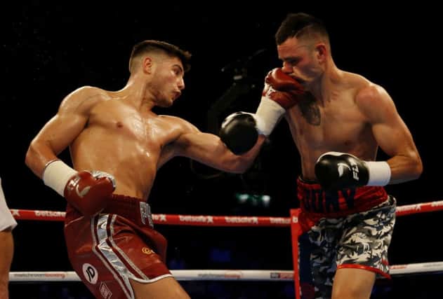 Josh Kelly (left) in action against Jony Vinaat during their Welterweight bout.