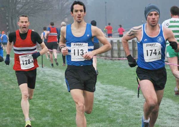 Sunderland Harrier Ian Dixon, far right, leads the Durham Cathedral Veterans relay race.