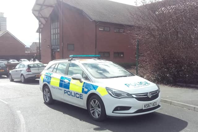 A police car at the scene in Hendon Road today