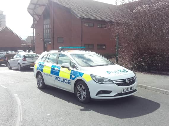 A police car at the scene in Hendon Road today