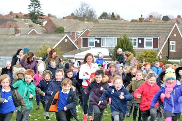 Sunderland marathon runner Aly Dixon joins children at East Herrington Primary School to raise money for Sport Relief.