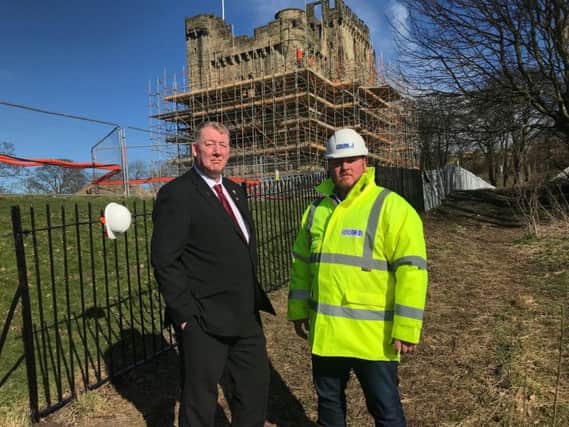 Councillor John Kelly, Sunderland City Council Portfolio Holder for Public Health, Wellness and Culture, joins site manager Simon Hills, at Hylton Castle to see how work is progressing