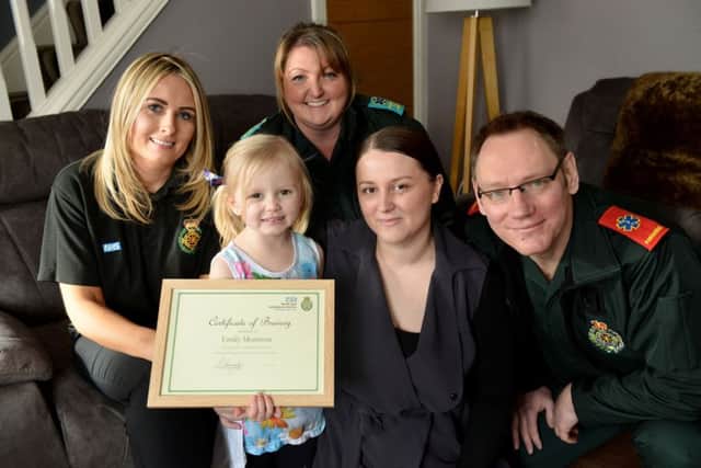 Emily Morrison with her mum Louise Rush next to her with and left to right are call handler Kerri Corbett, emergency care assistant Nicola Johnson and paramedic Mark Johnson.
