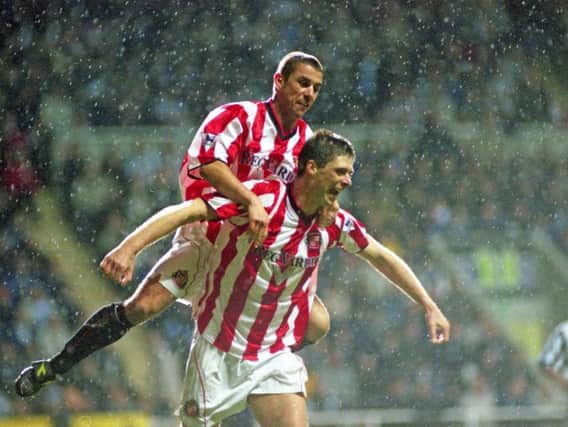 Niall Quinn celebrates with Kevin Phillips after scoring against Newcastle United.