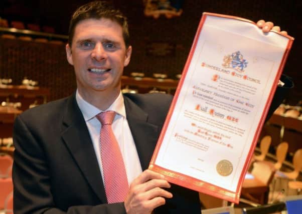 Niall Quinn with his Freedom of the City of Sunderland scroll.