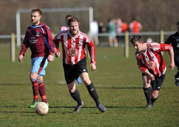 Sunderland West End (red/white) attack against Annfield Plain last weekend. Picture by Tim Richardson