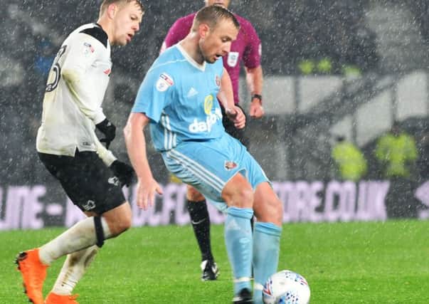 Lee Cattermole plays a pass under pressure in Friday's win at Derby. Picture by Frank Reid