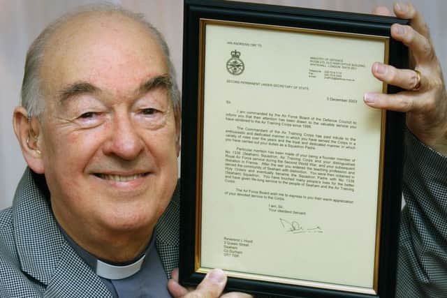 Reverend Les Hood, pictured in 2006, with his letter from the Defence Council praising his work with the Air Training Corps.