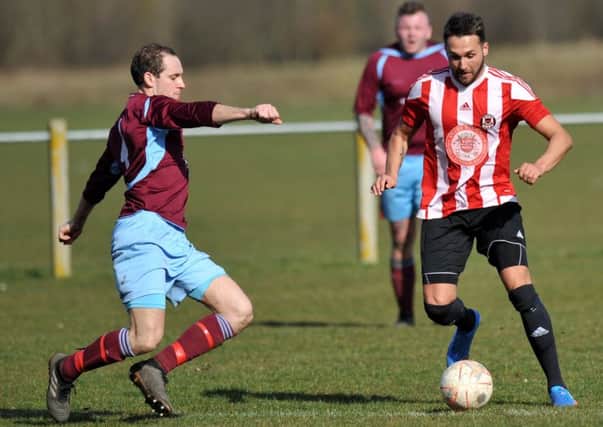 Sunderland West End's Kevin Gordon (red/white) attacks against Annfield Plain last weekend. Picture by Tim Richardson