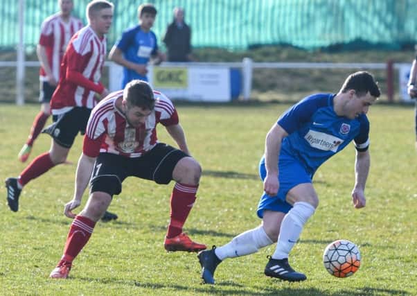 Sunderland RCA's Michael Charlton (red/white) loses out against Seaham Red Star last week. Picture by Kevin Brady