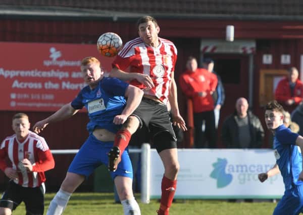 Sunderland RCA's Nathan O'Neill (red/white) wins an aerial duel against Seaham Red Star last week.  Picture by Kevin Brady