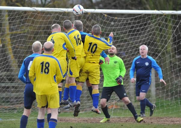 Doxy Lad (navy) take on Hedworthfield Red Hackle in the Over-40s League last week. Picture by Tim Richardson