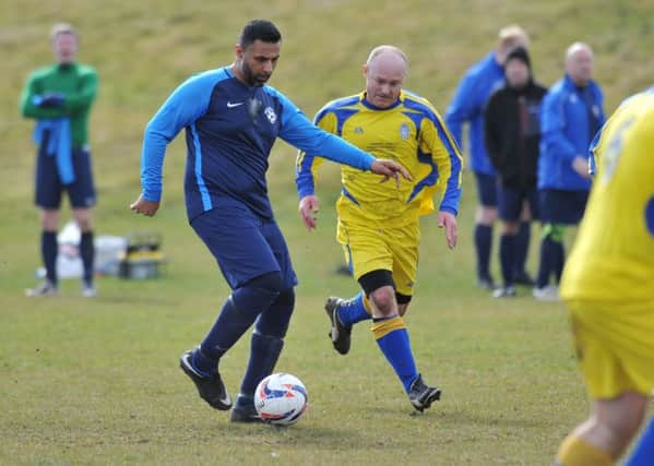 Doxy Lad (navy) attack against Hedworthfield Red Hackle in the Over-40s League last weekend. Picture by Tim Richardson