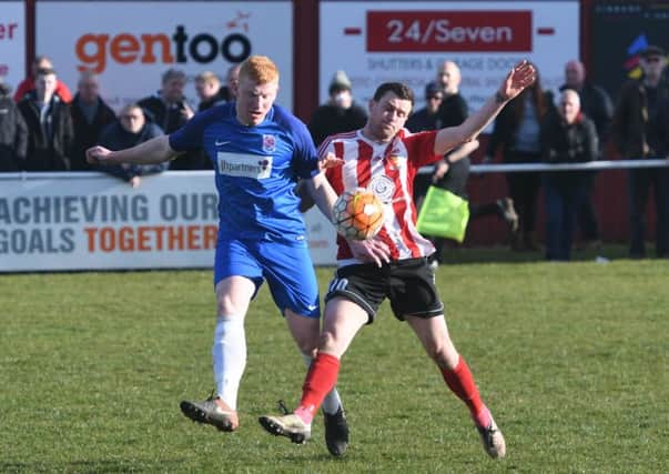 Sunderland RCA's Colin Larkin (red/white) battles it out against Seaham Red Star last weekend. Picture by Kevin Brady