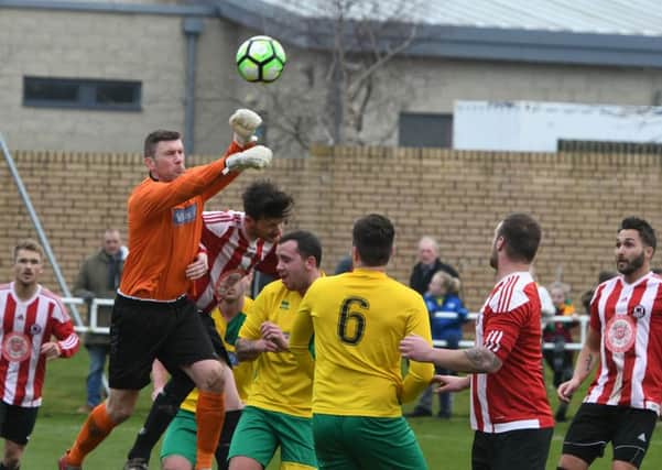 Sunderland West End (red/white) threaten the Leam Rangers goal in yesterday's Durham County Trophy final. Picture by Kevin Brady