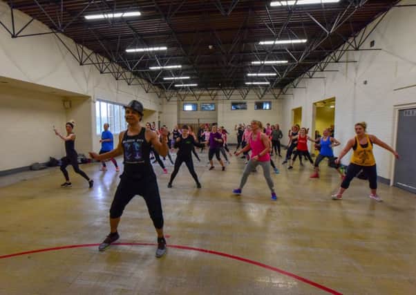 Chico takes an exercise class at Studio Burn Fitness in Houghton