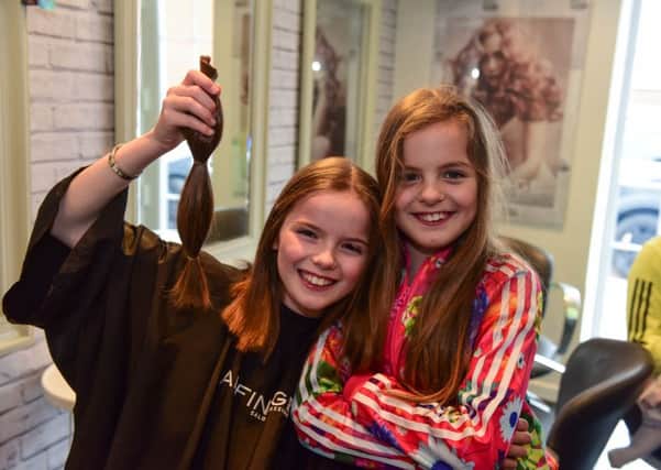 Having her hair cut for the Little Princess Trust on Good Friday was 10-year-old Isla McNicholas, by saolon owner Lucy Donnelly at MISSI salon, Rose Street East, Penshaw. Isla is pictured with twin sister Avah.
