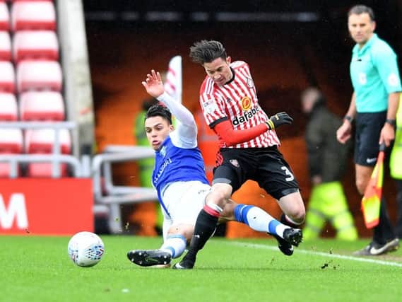 Bryan Oviedo battles for the ball in the defeat to Sheffield Wednesday.
