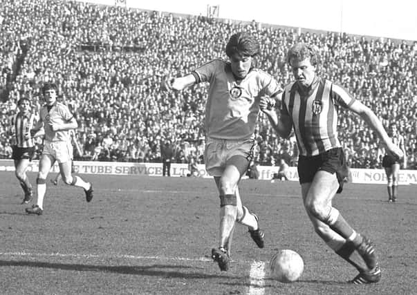 Sunderland striker Alan Brown tries to get in a shot against Newcastle on April 5, 1980