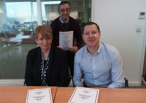 Carol Harries, left, Chris Cordner, centre, and Gavin Foster, right, at the judging of the Best of Health Awards.