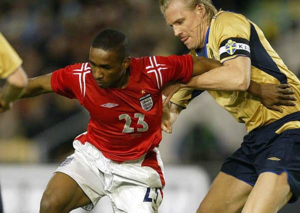 Johan Mjallby (right, challenging Jermain Defoe) was a snus user during his playing days