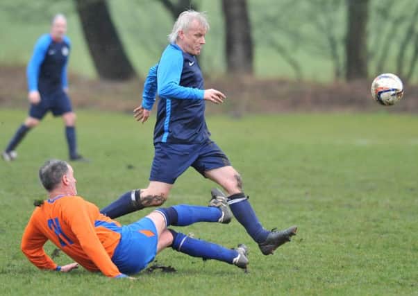Over-40s action as Doxy Lad (navy) take on Trimdon Vets last week. Picture by Tim Richardson