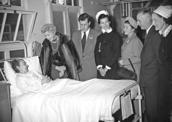 Mrs Mary Fromson chatting with Barbara Kelly and Bernard Braden who visited patients in the Sunderland General Hospital  before their show in the Seaburn Hall last night.  Others present are Mr George Weir, Chairman of League of Hospital Friends, and Mrs Weir; the Matron, Miss J E LIllington; and the Assitant Matron, Sister  E Stead.  Wednesday October  9 1957