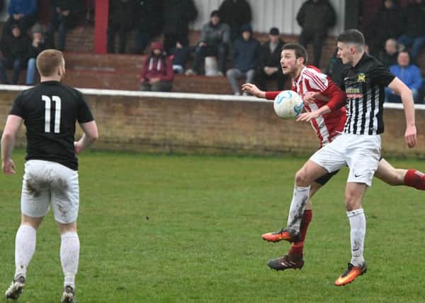 Sunderland RCA's hat-trick hero Nathan O'Neill (red/white) battles against Newcastle Benfield in Division One on Saturday. Picture by Kevin Brady.