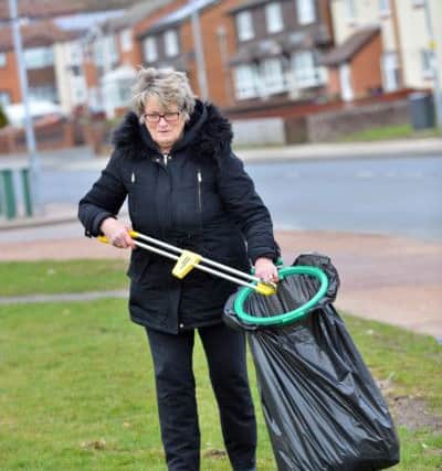 Mayor Councillor Doris MacKnight does her bit during the clean up session.