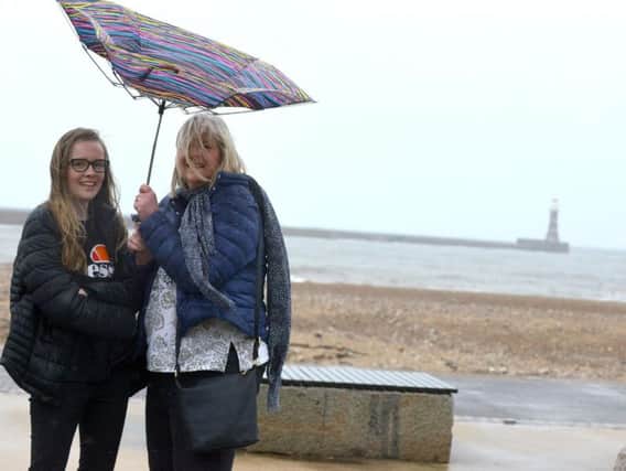 Gill Brown with daughter Erin Brown at a rainy Sunderland seafront today