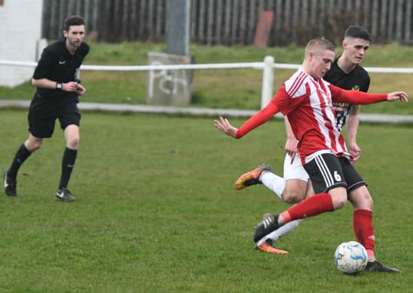 Sunderland RCA (red/white) v Newcastle Benfield (black/white) at Meadow Park, Ryhope on Saturday.