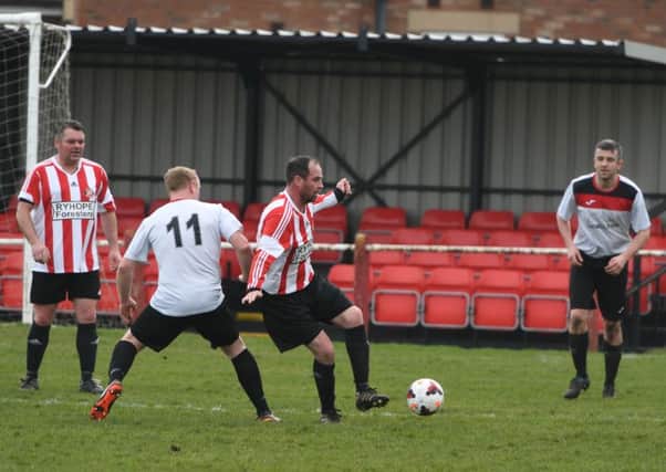 Over-40s action as Ryhope Foresters (red/white) battle against Redhouse WMC. Picture by Kevin Brady