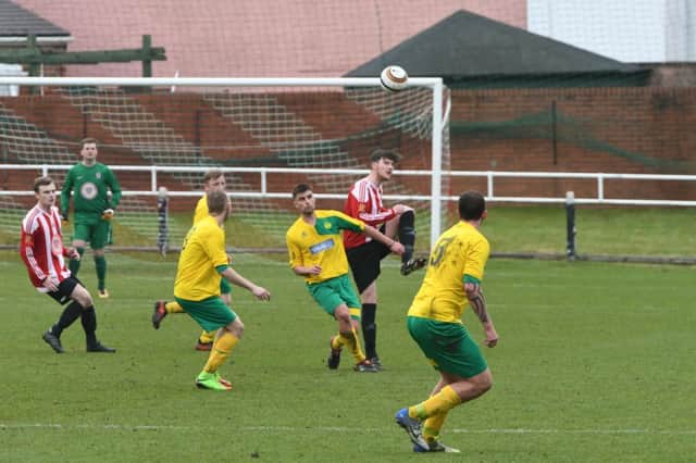 Sunderland West End (red/white) take on Leam Rangers in their recent cup final