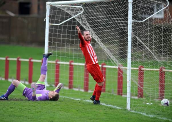 Josh Home-Jackson celebrates his opener for Ryhope CW against Morpeth. Picturw by Tim Richardson