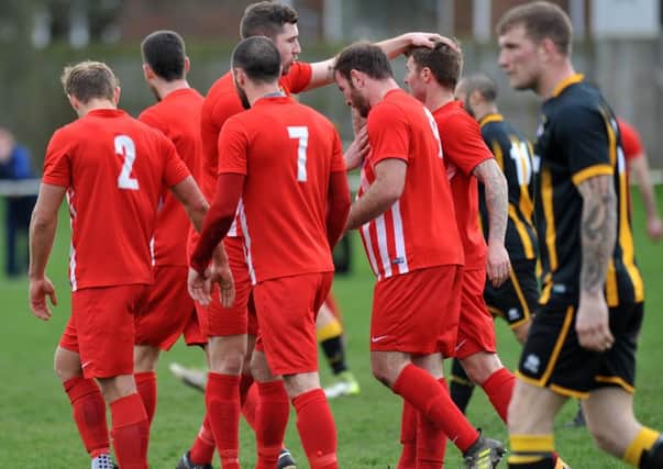 Ryhope CW (red) celebrate going ahead against Morpeth Town in Saturday's Division One game. Picture by Tim Richardson